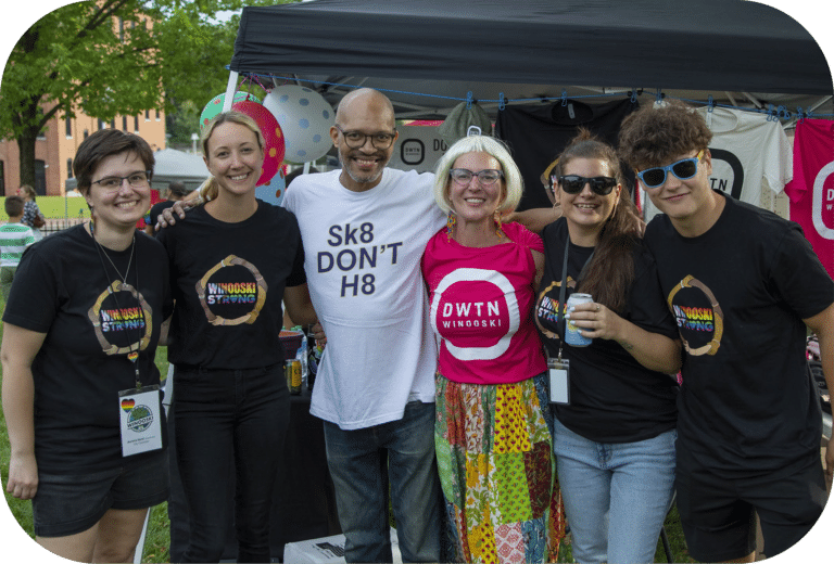 Members of Downtown Winooski board, City Council, and partner organizations smiling at Pride